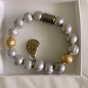 Beautiful beaded bracelet-slip on elastic with gold shell detail. Charleston, SC